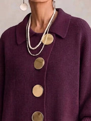Close up of the burgundy cardigan collar and large gold front buttons