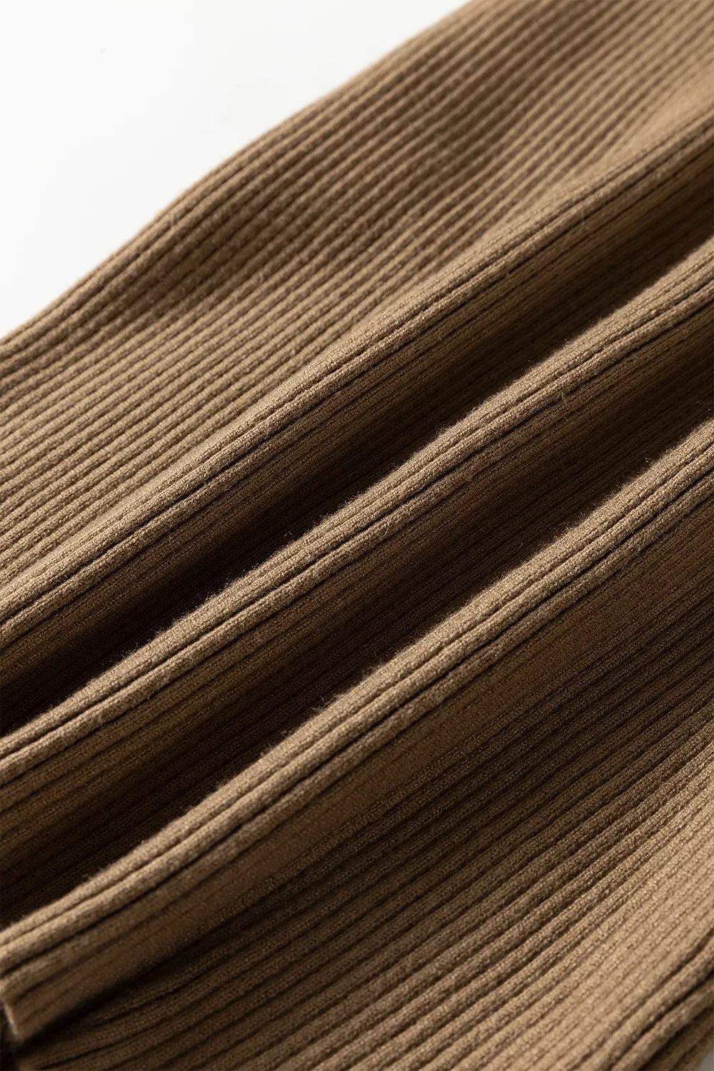 Close up of the mocha ribbed knit fabric folded in soft layers