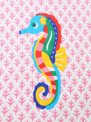 Close-up of the striped multicolor seahorse print on the blush pink children's tee