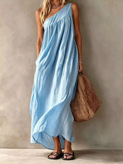 Full length front view of a light blue one shoulder maxi dress on a model