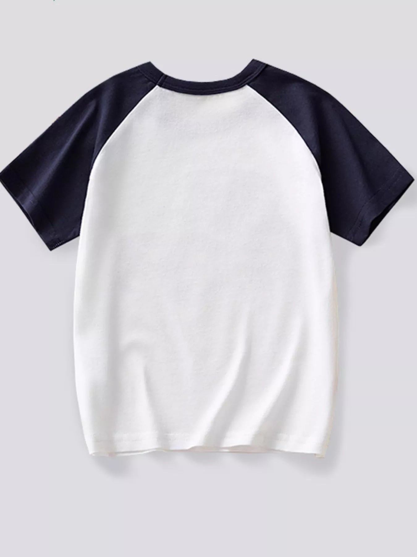 Back view of the white children's T-shirt with navy raglan sleeves laid flat
