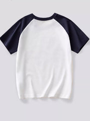 Back view of the white children's T-shirt with navy raglan sleeves laid flat