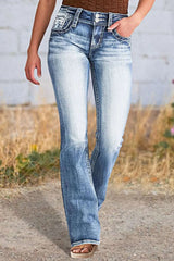 Women's bootcut jeans with star embroidery, buttons, and pockets.
