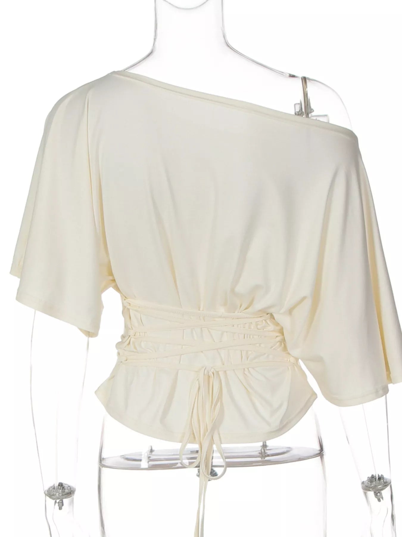 Ivory boat-neck short-sleeve top with a gathered waist and front drawstring detail on a mannequin