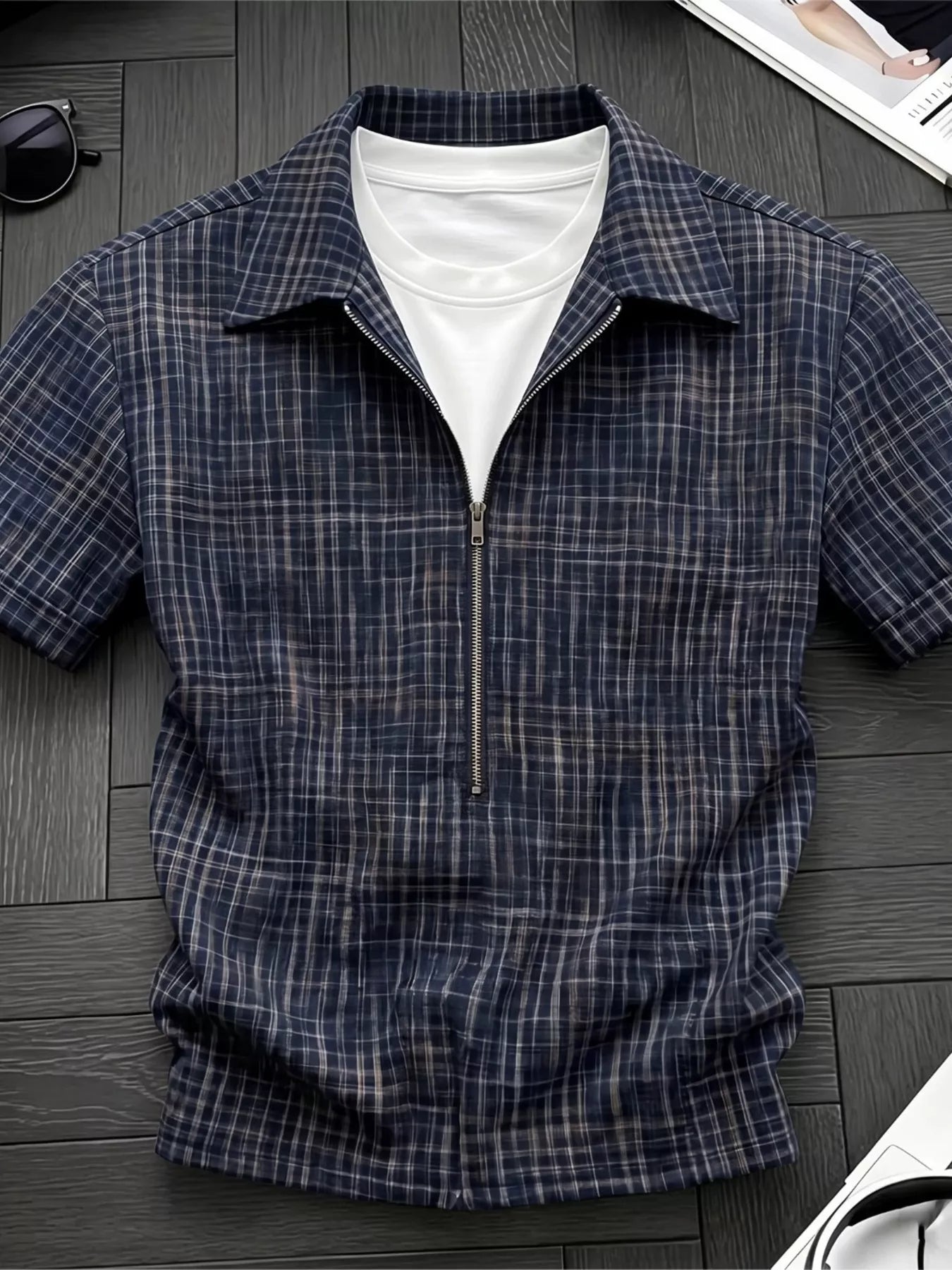 Men's plaid short-sleeve shirt with zipper detailing, made from polyester.