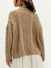 Back view of khaki cable knit sweater with cable pattern and white skirt