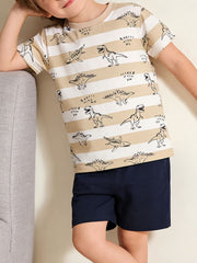 Children's tan and white striped crew neck T-shirt with dinosaur print, shown worn in front view