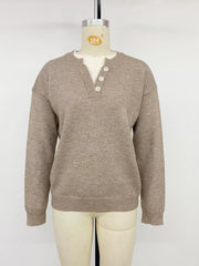 Khaki dropped shoulder sweater with V neck button placket on mannequin, front view