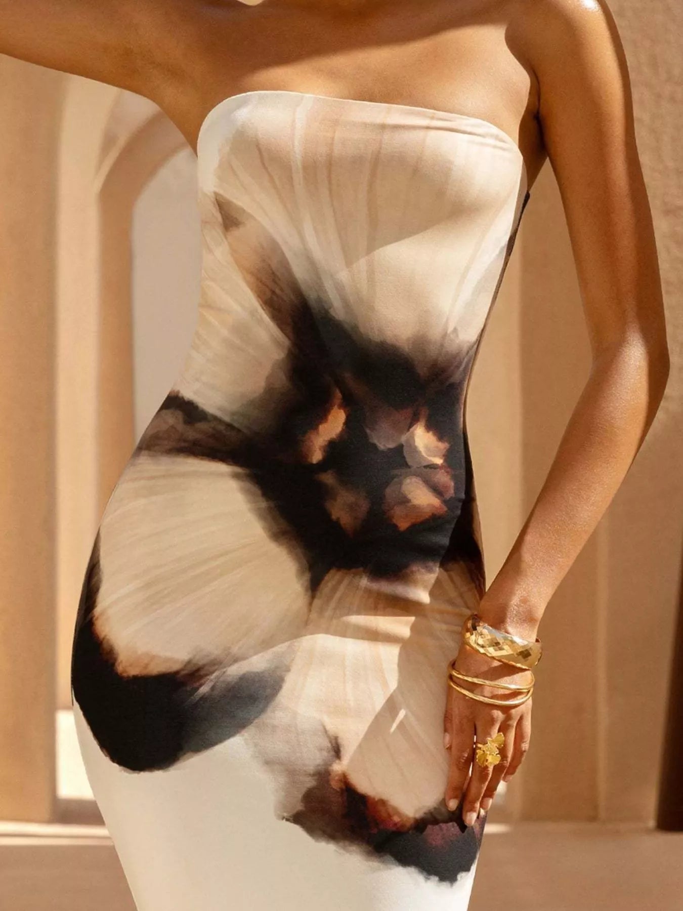 Close up of strapless white and black floral tube maxi dress bodice