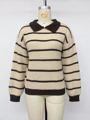 Front view on a mannequin of a cream and brown striped knit polo sweater.