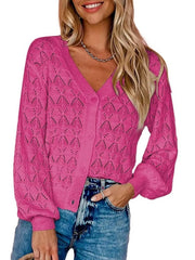 Front view of bright pink openwork leaf knit cardigan with V neck and button front.