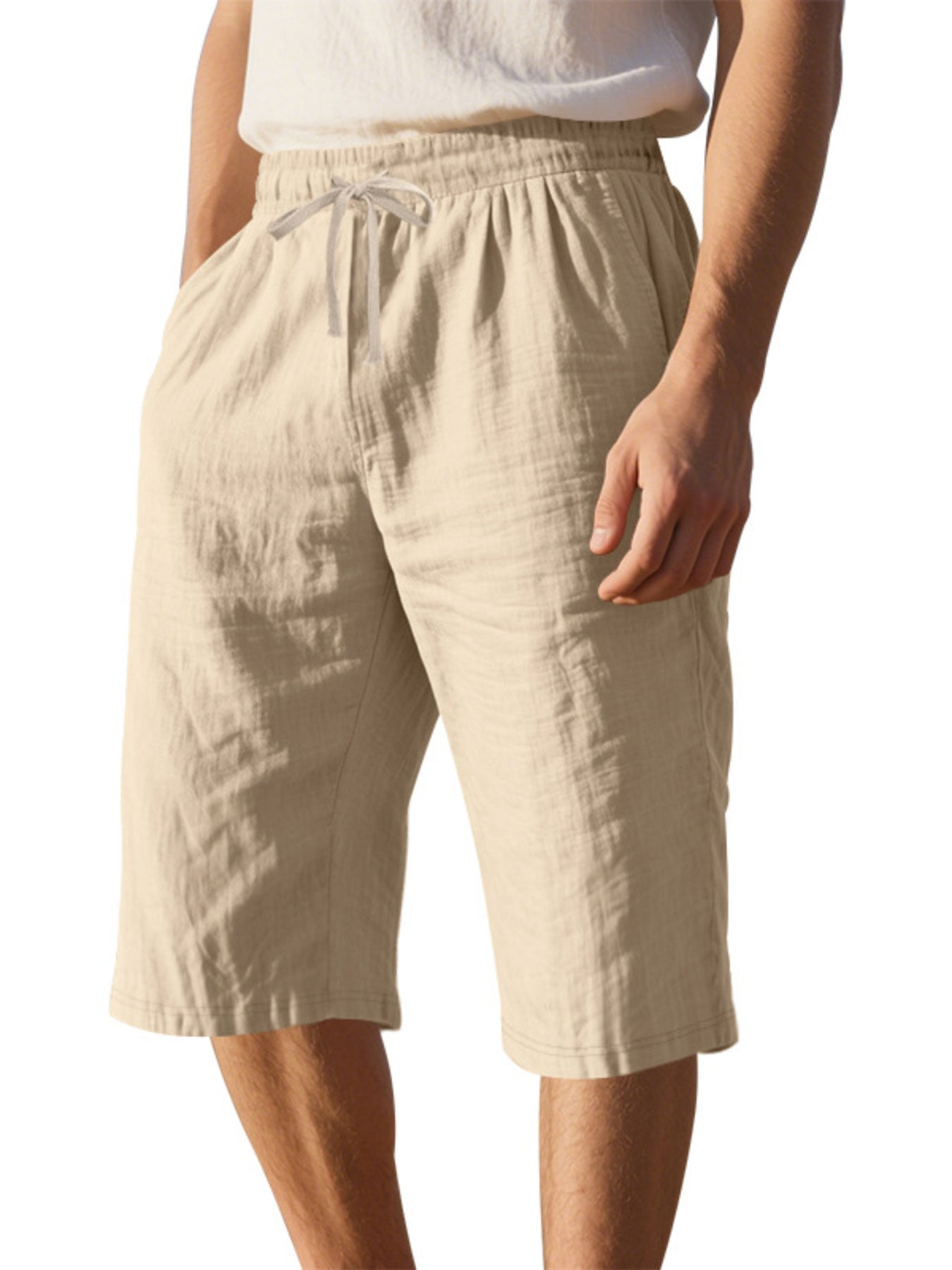 Men's casual shorts with a drawstring waist and pockets in the light khaki color.