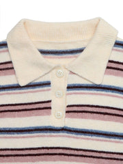 Close-up flat lay of a cream polo collar with three buttons on a striped sweater
