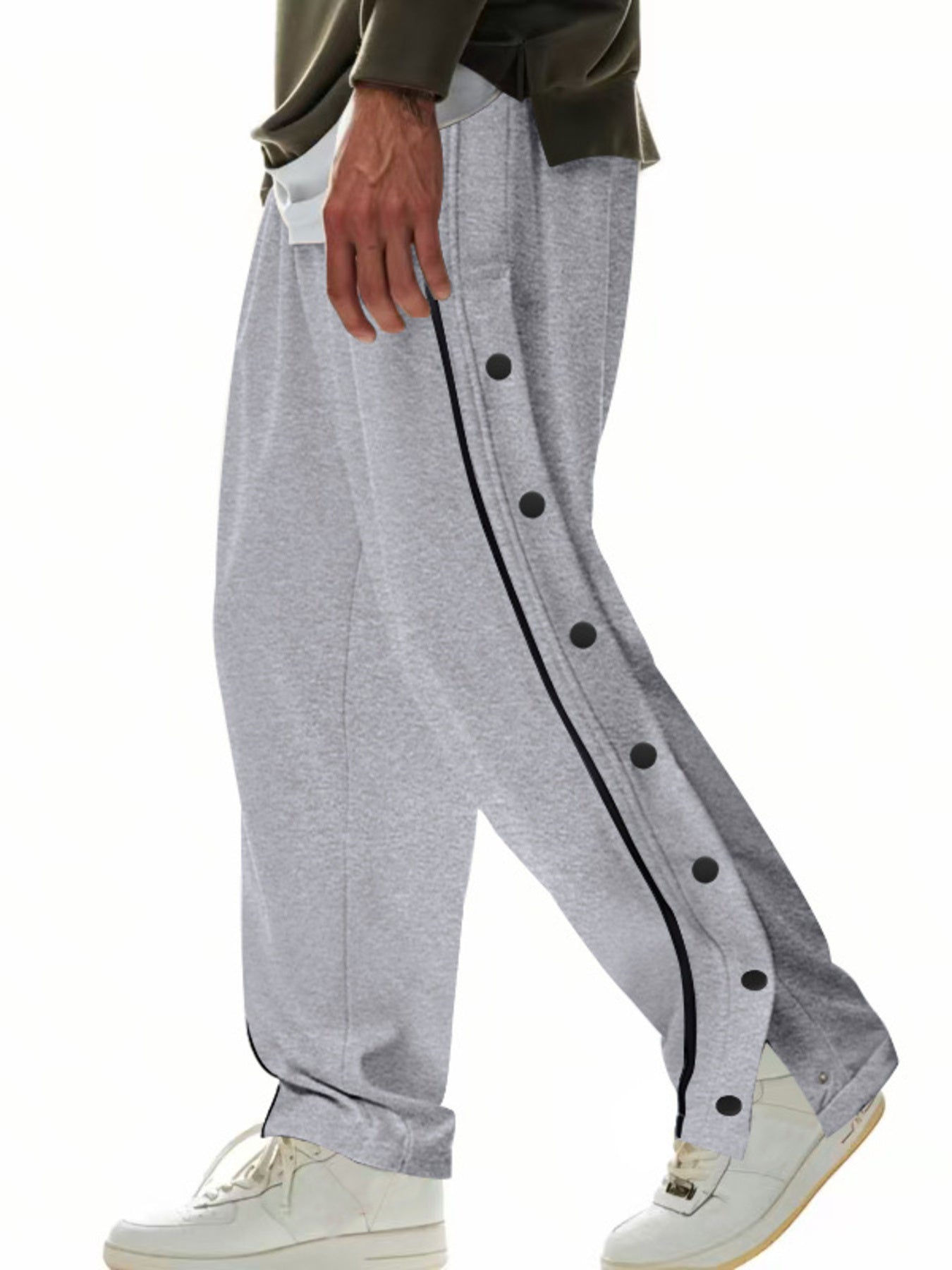 Men's grey loose-fit track pants with side snap buttons and pockets.