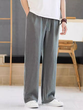 Men's dark gray casual pants with a drawstring waist and pockets.
