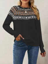 On-model front view of black crew neck sweater with Fair Isle pattern across chest and shoulders