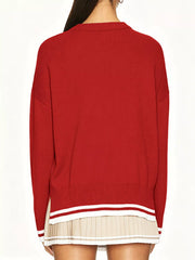 Back view of the red dropped shoulder sweater with plain back and striped hem and cuffs.