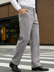 Men's gray dress pants with a classic fit and pockets.