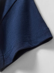 Close view of the stitched short sleeve hem on the dark navy children's t-shirt