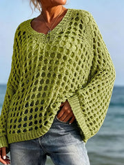 Front view of lime green openwork crochet knit cover up with V neck at the beach.