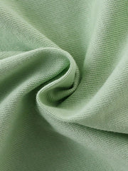 Close view of the soft twisted sage green knit fabric texture of the children's T-shirt