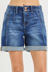 Women's high-rise shorts with seamed details, buttons, and rolled hems.