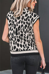 Back view of the black and cream leopard print high neck sweater with cap sleeves and black trim.