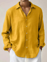 Men's long-sleeve button-up shirt made from a cotton-spandex blend.