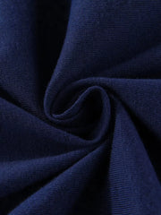 Close-up of the dark navy fabric texture in a soft gathered fold
