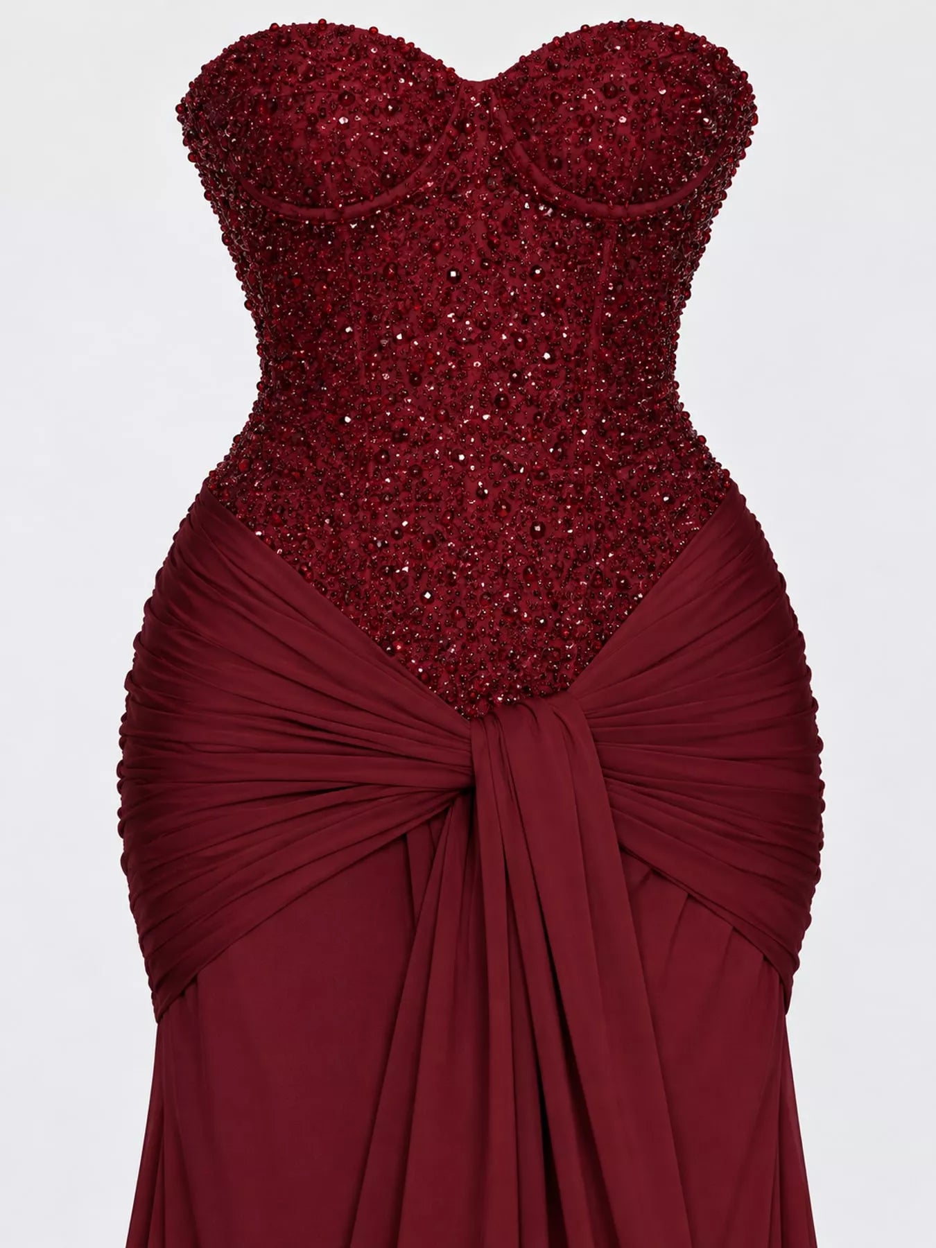 Red strapless sequin corset bodice and knotted draped waist, close detail view