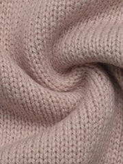 Close up of soft pink knit fabric showing its fine ribbed texture