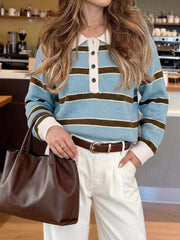 Front view of light blue striped polo sweater with cream collar and black buttons.