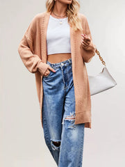 Side angle of the apricot long open front cardigan with openwork stripes
