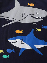 Close-up print detail of gray and blue sharks with small yellow blue and green fish