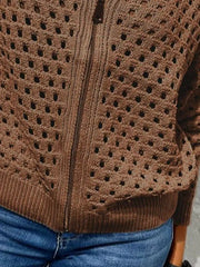Close up of the dark brown crochet cardigan lower zip and ribbed hem