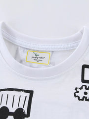 Close-up of the white crew neckline and label above black construction vehicle prints