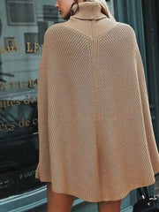 Back view of camel ribbed turtleneck poncho sweater