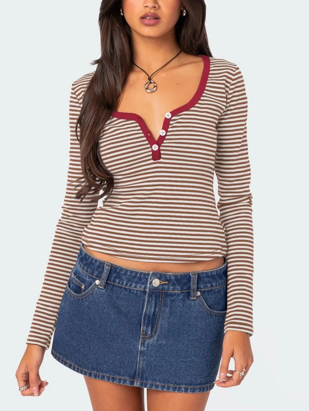 Brown and white striped long sleeve t shirt with deep red trim and white buttons worn on model front view