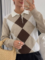 Mirror selfie front view of a beige, brown, and white argyle polo collar sweater