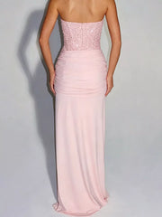 Pink strapless sequin corset maxi dress on model, full length back view showing zip