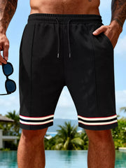 Men's black textured knit shorts with a drawstring waist and pockets.