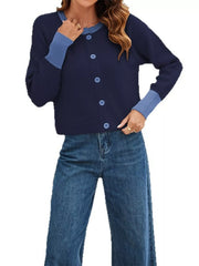 On-model front view of the navy cardigan with light blue trim and a hand at the collar