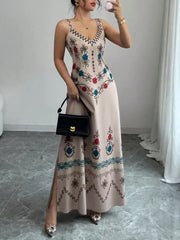 Gray floral sleeveless maxi dress with side slit shown from the front on model