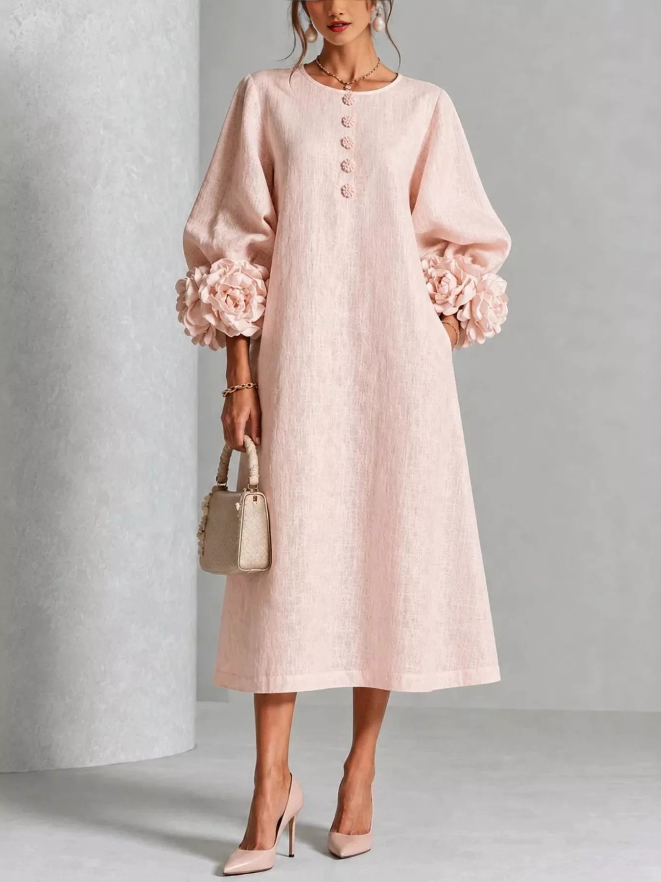 Watermelon pink round neck midi dress with balloon sleeves, floral cuffs and small floral buttons, front view
