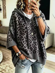 Gray leopard print oversized hooded knit sweater with drawstrings, front view on model
