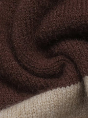 Close up of soft brown and beige knit texture on color block sweater.