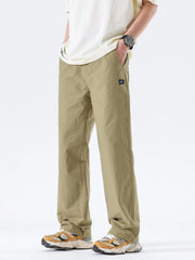 Men's khaki wide-leg casual pants with a polyester-blend composition.