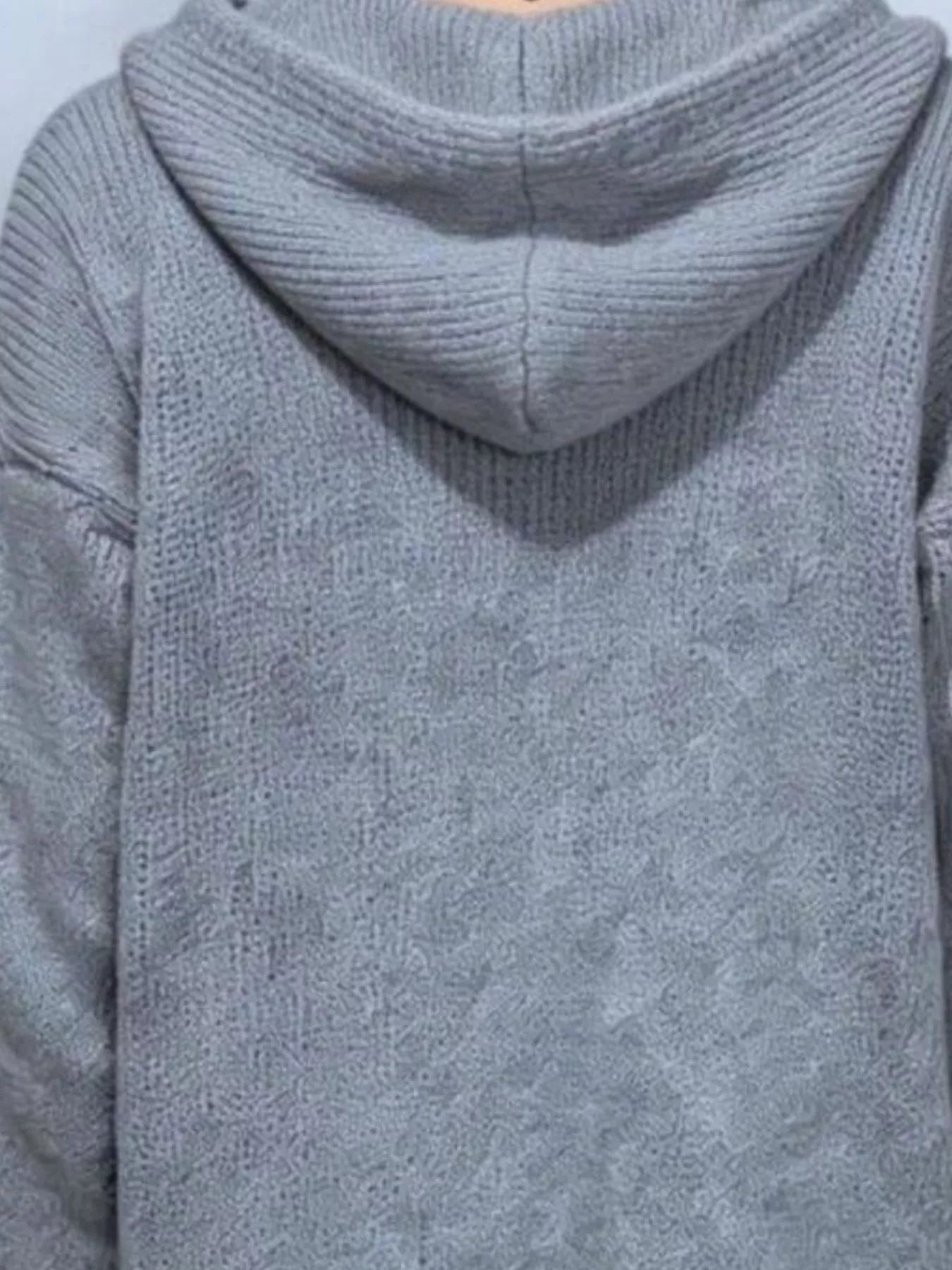 Back view showing the gray knit hood and soft textured fabric