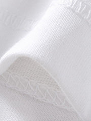 Close view of white polo fabric and seam stitching detail on a children's shirt