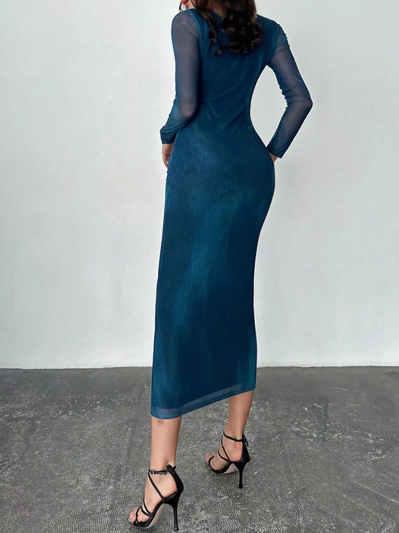 Blue tie dye long sleeve bodycon maxi dress viewed from behind on a model